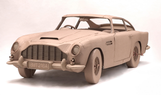 Illustration for article titled Full-Size Cardboard Aston Martin for Papier-Mâché Bonds